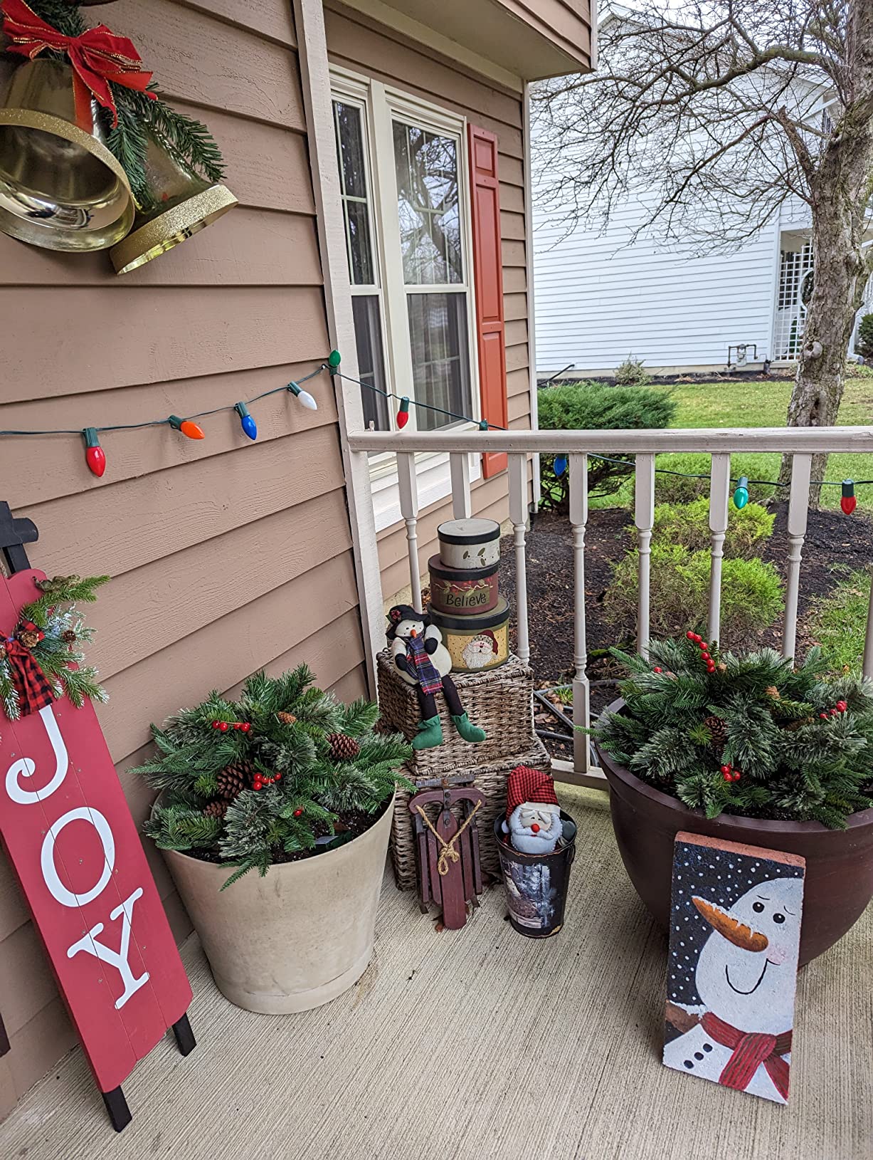 Pre-lit Artificial Christmas Tree Urn Filler / Weatherproof sparkle for entryways and patios.